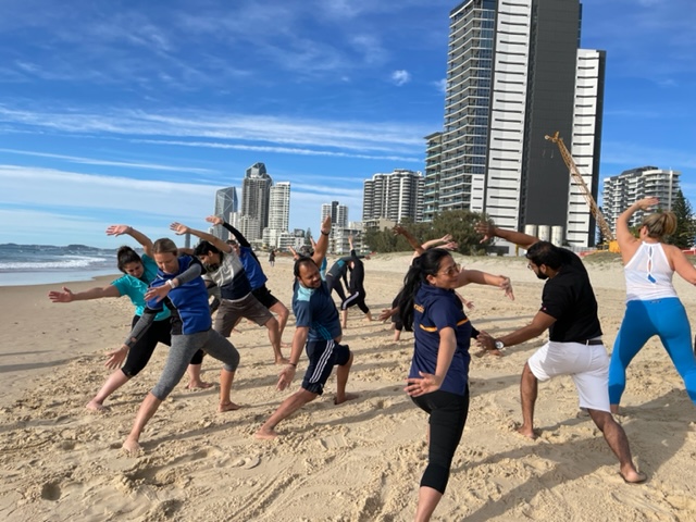Gold Coast Amazing Race Activities to do on Surfers Paradise beaches. Here we yoga stretch teams abilities to perform. 